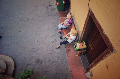High angle view of people sitting outside house