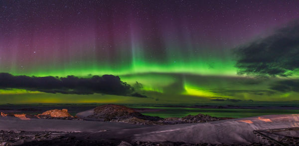 Scenic view of landscape against sky at night