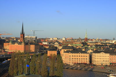 High angle shot of townscape against clear blue sky