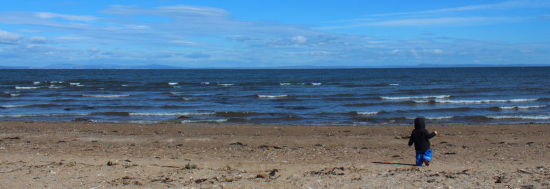 Woman standing on beach