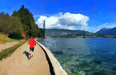 Man on beach against sky