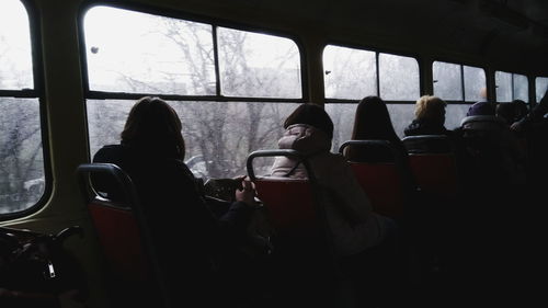 Rear view of woman in train