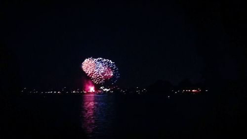 Firework display at night