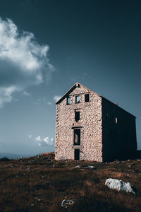 Low angle view of old building against sky