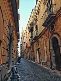 Narrow street amidst buildings in town of procida