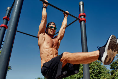 Low angle view of man standing against sky