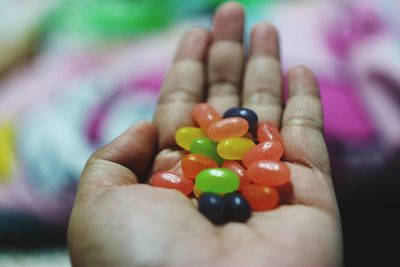 Close-up of hand holding candies