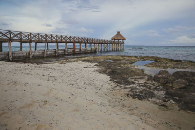 Pier over sea against sky