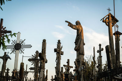 Low angle view of statue against sky