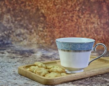 Close-up of coffee cup on table