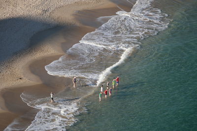 High angle view of people on shore at beach