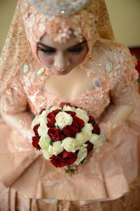 Woman holding flower bouquet