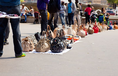 Low section of people walking on street