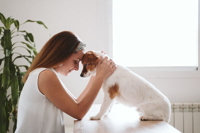 Side view of woman with dog