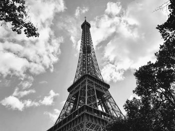 Low angle view of tower against cloudy sky