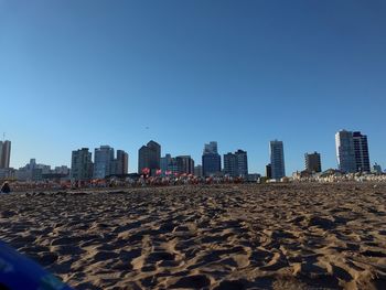 Panoramic view of beach against clear sky