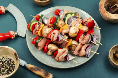 Tasty kebabs on plate