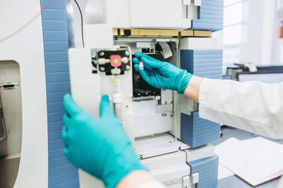 Cropped hands of scientist experimenting at laboratory