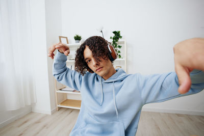 Man listening music at home