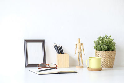 Table and chairs against white background