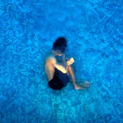 Man swimming in pool