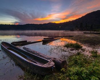 Scenic view of lake against sky during sunset