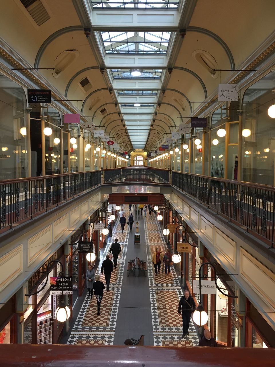 indoors, illuminated, real people, large group of people, architecture, transportation, men, built structure, women, public transportation, modern, technology, day, people