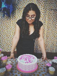 Full length of a woman in a cake