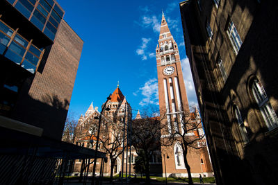 Low angle view of buildings in city against sky