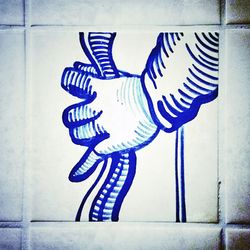 Close-up of painting on wall