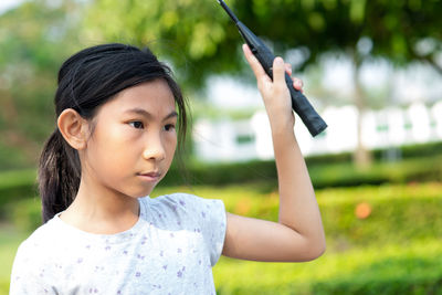 Girl holding badminton racket