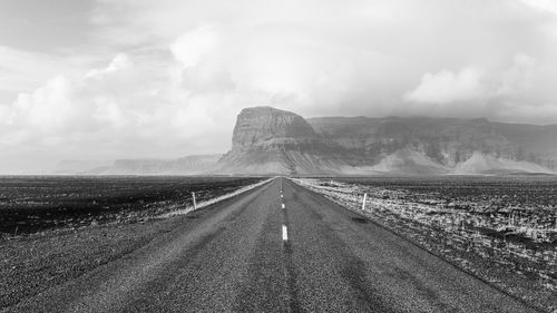 Road by land against sky