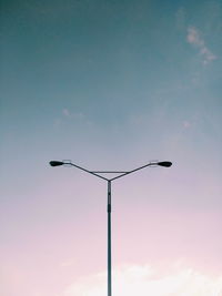 Low angle view of street light against sky