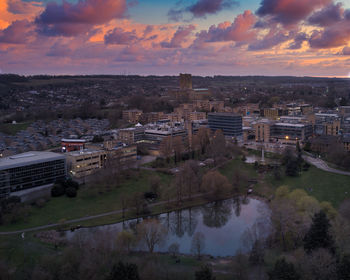 High angle view of buildings against sky at sunset