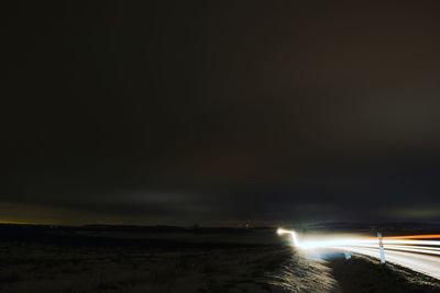 Light trails against sky at night