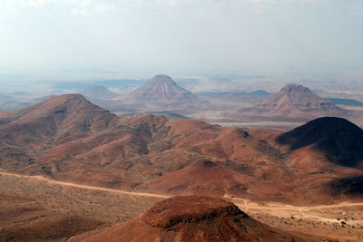 Scenic view of arid landscape against sky