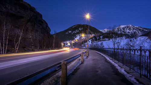 Light trails on road in city at night