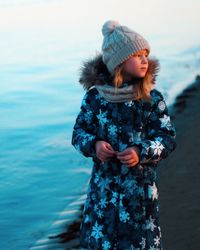 Full length of woman standing in snow