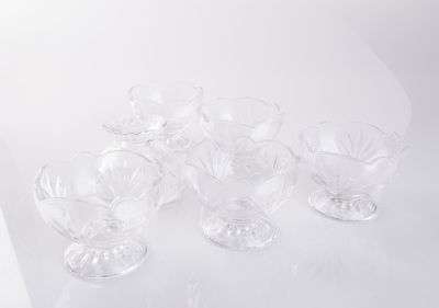 High angle view of glassware on white background