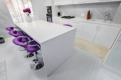 High angle view of empty chairs at home