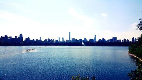 Panoramic view of sea and city against sky