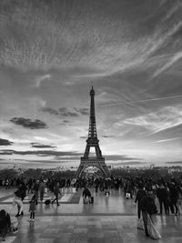 People in the trocadero place  in paris with the eiffel tower. 