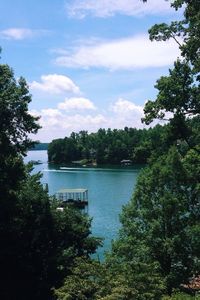 Scenic view of lake against cloudy sky