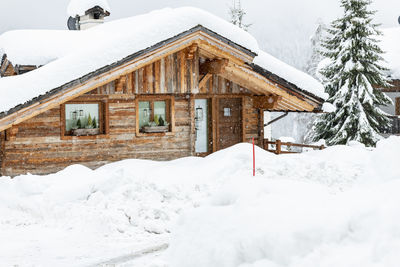 Under a heavy snowfall. walk in the ancient village of sappada. friuli