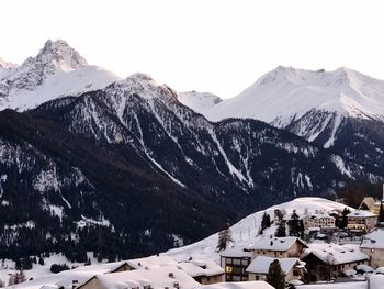 Scenic view of snowcapped mountains against clear sky