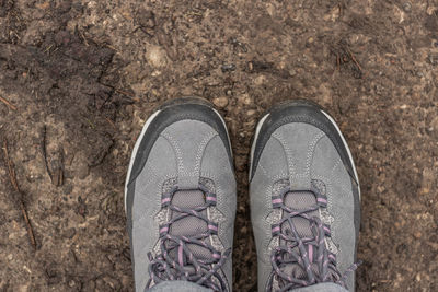 Low section of person standing on ground