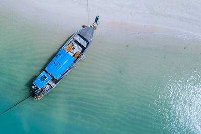 High angle view of long tail boat on the beach 