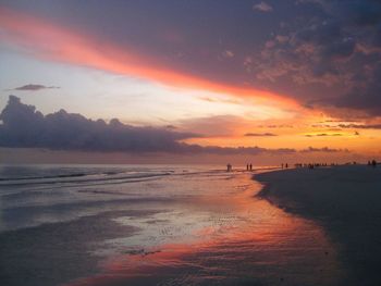 Scenic view of beach against sky during sunset