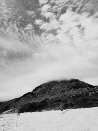 Scenic view of snow covered mountain against sky