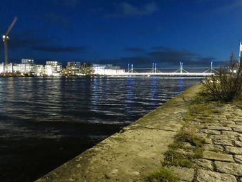 View of illuminated sea at night